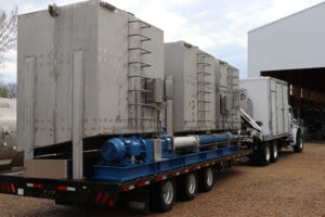 Mobile unit truck pulling into building